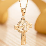 lifestyle image of hand engraved gold celtic cross necklace