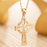 lifestyle image of hand engraved gold celtic cross necklace