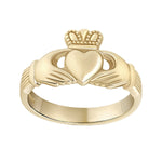 stock image heavy gold Claddagh ring on white background 2