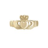 stock image heavy gold Claddagh ring on white background 4