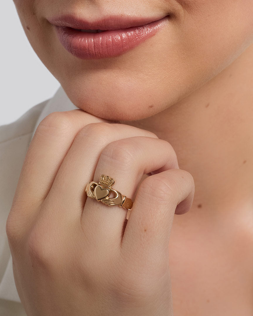 Ladies yellow Gold heavy Claddagh Ring on a model