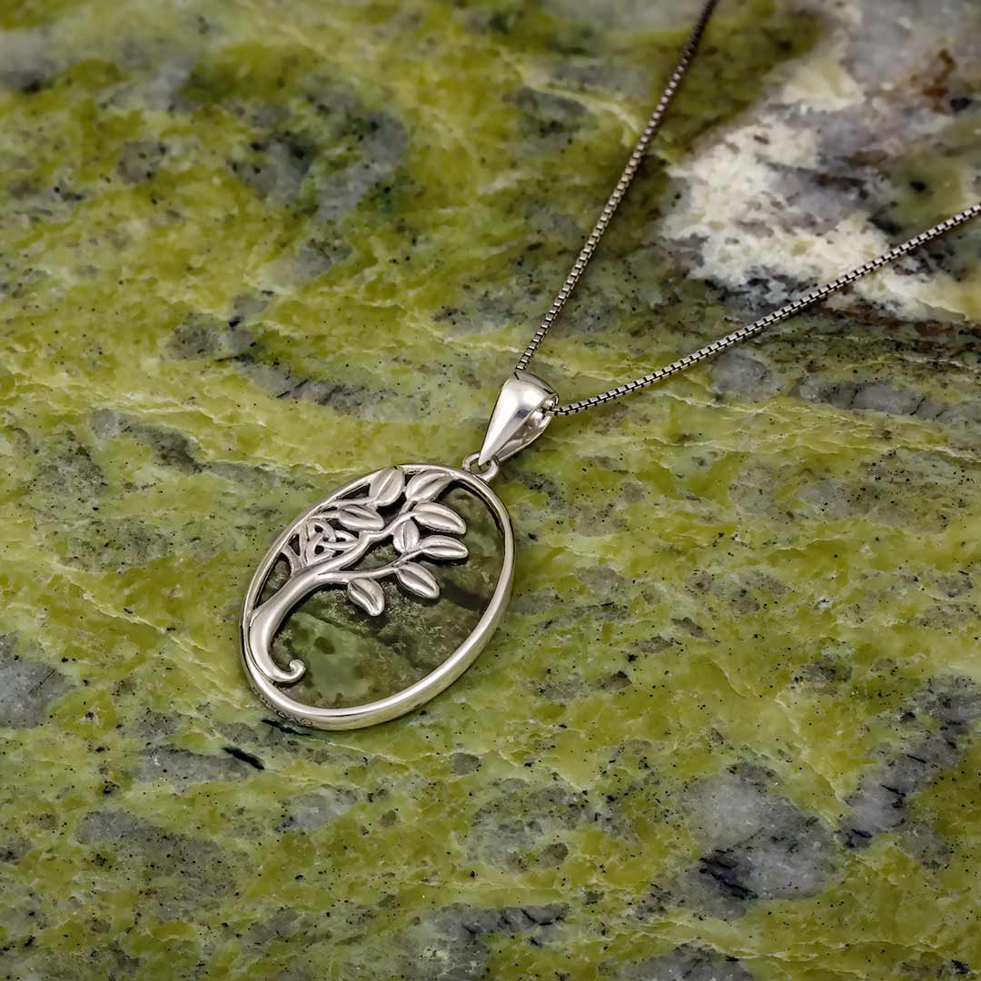 lifestyle image of Connemara marble Irish Tree of Life necklace S46026 on green marble