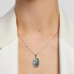 green marble oval Tree of life necklace on a model