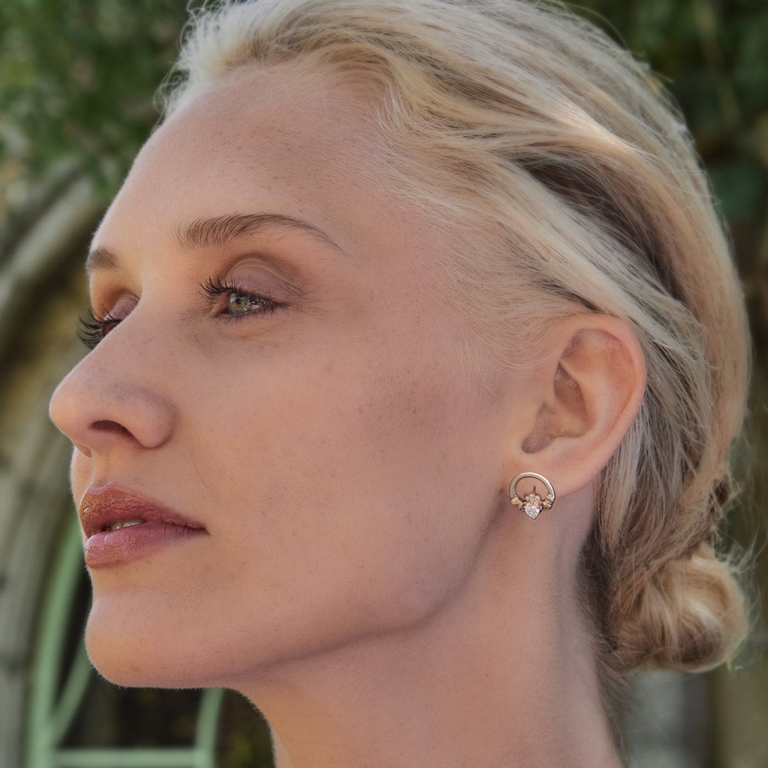 lab diamond Claddagh earrings on a model