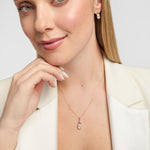Model wearing matching lab-grown diamond Trinity Knot necklace and earrings