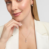 Model wearing matching lab-grown diamond Trinity Knot necklace and earrings