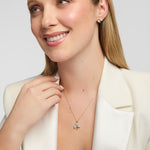 Model wearing a matching lab-grown diamond Shamrock jewellery set crafted in yellow gold