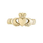 stock image of ladies yellow gold Claddagh ring on the white background 3