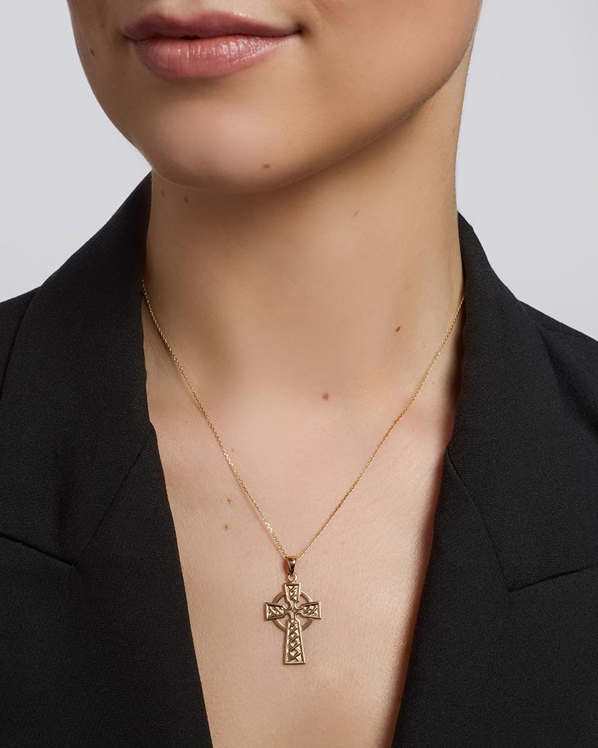 olvar 14k gold large celtic cross pendant on a model