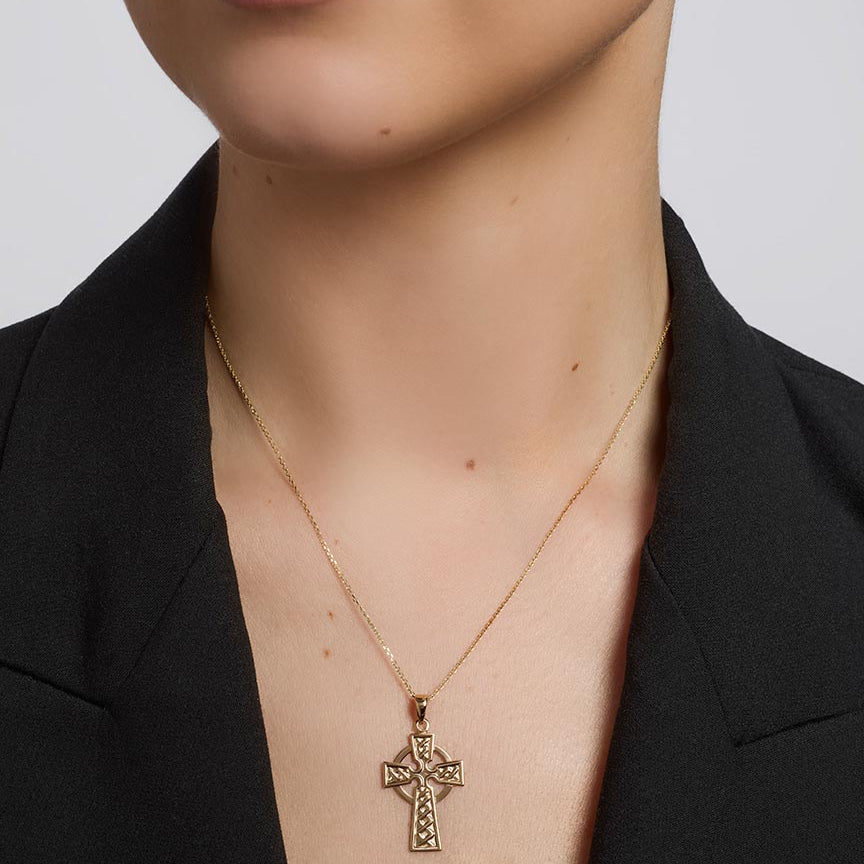 olvar 14k gold large celtic cross pendant on a model