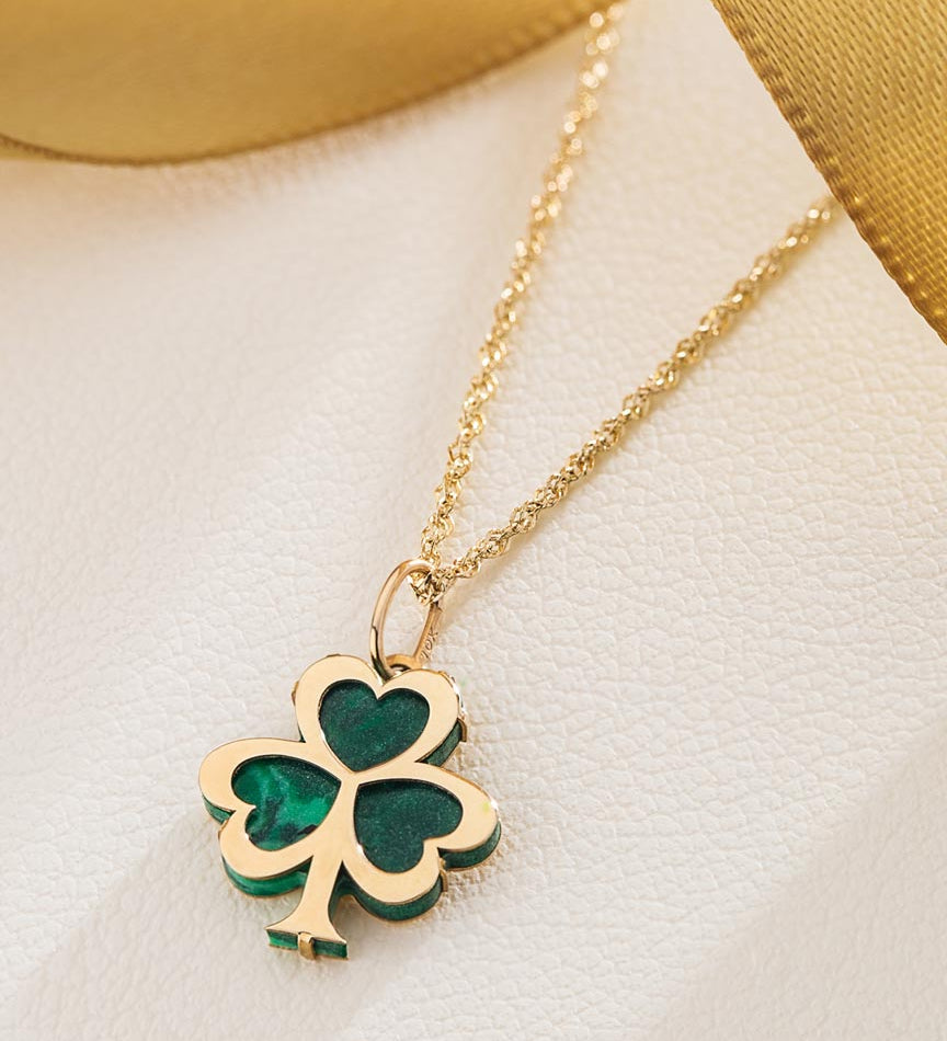 lifestyle image of malachite gold shamrock necklace from solvar