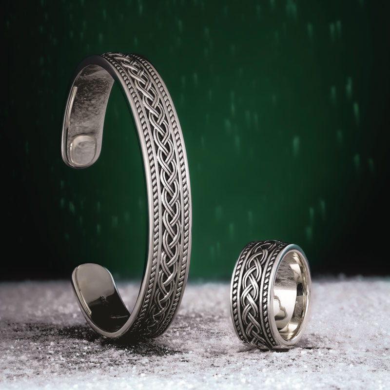 lifestyle image of the matching set of mens heavy celtic bangle and ring