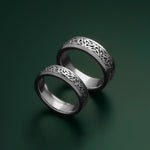 lifestyle image of mens and womens trinity knot bands in silver