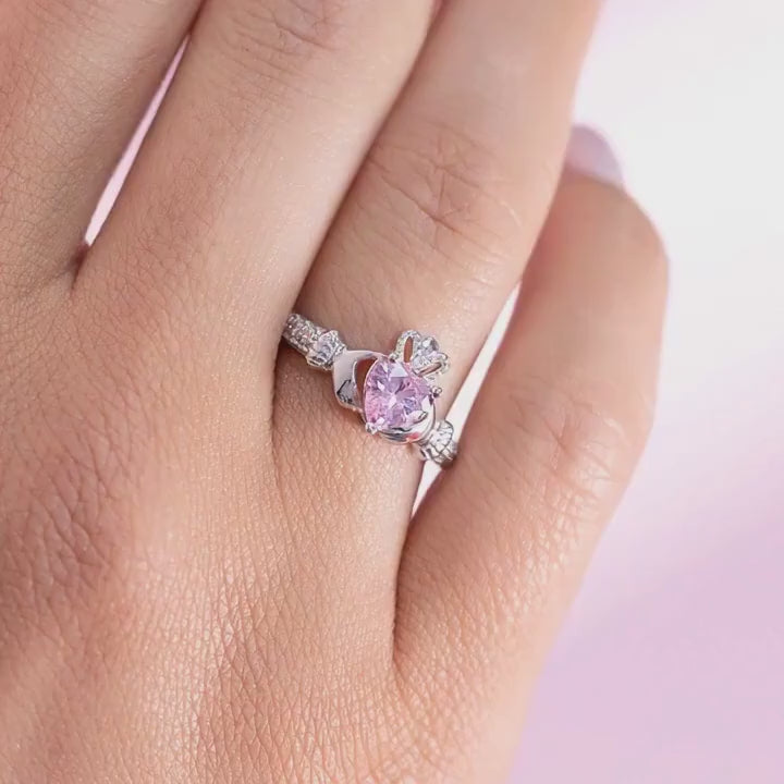 a close-up video of October birthstone claddagh ring on a female hand