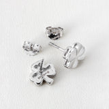 front and back side image of silver shamrock stud earrings from Solvar