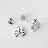 lifestyle image of front and back sides of silver shamrock earrings s33152 from Solvar