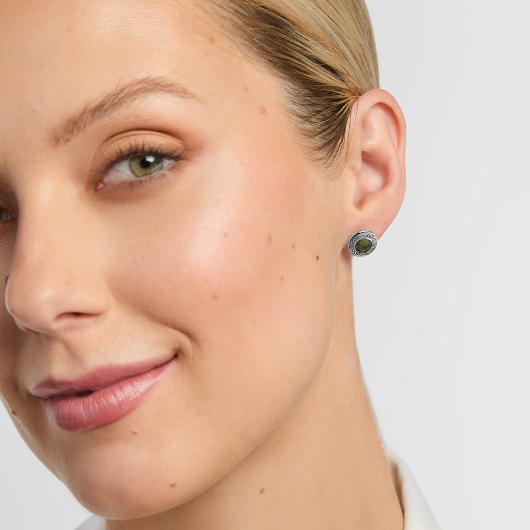 connemara marble celtic stud earrings on a model