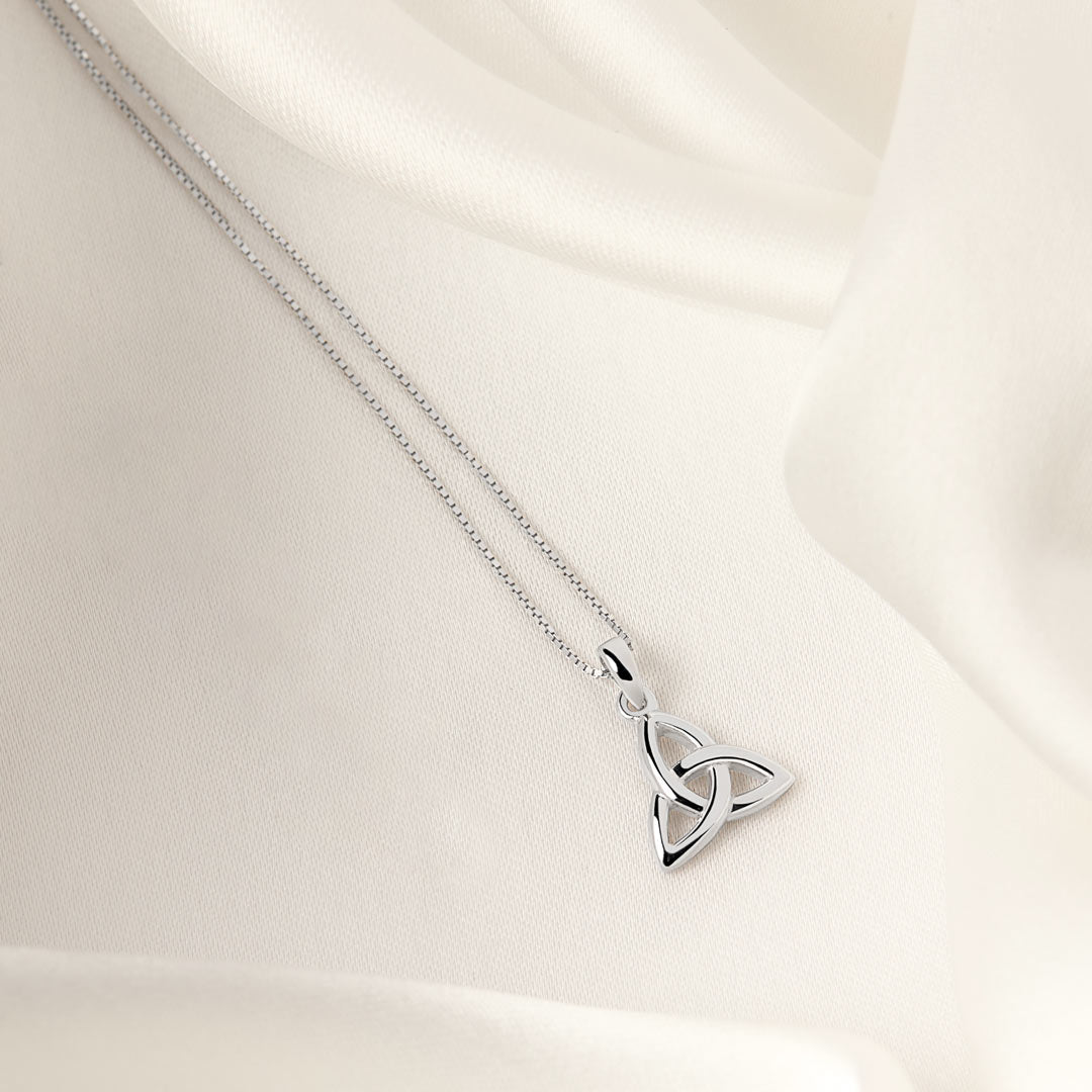 lifestyle image of kid's Celtic Trinity Knot necklace in silver 