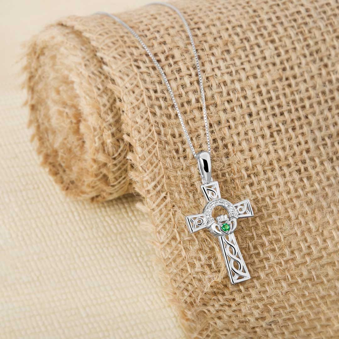 lifestyle image of Celtic Claddagh Cross pendant in silver