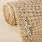 lifestyle image of Celtic Claddagh Cross pendant in silver