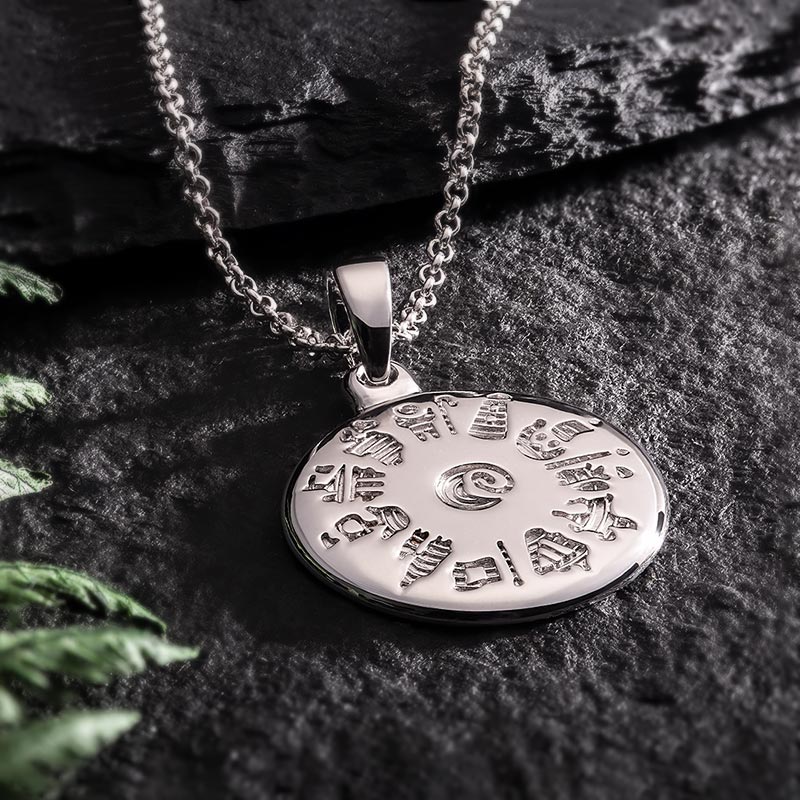 lifestyle image of history of Ireland disc pendant in silver