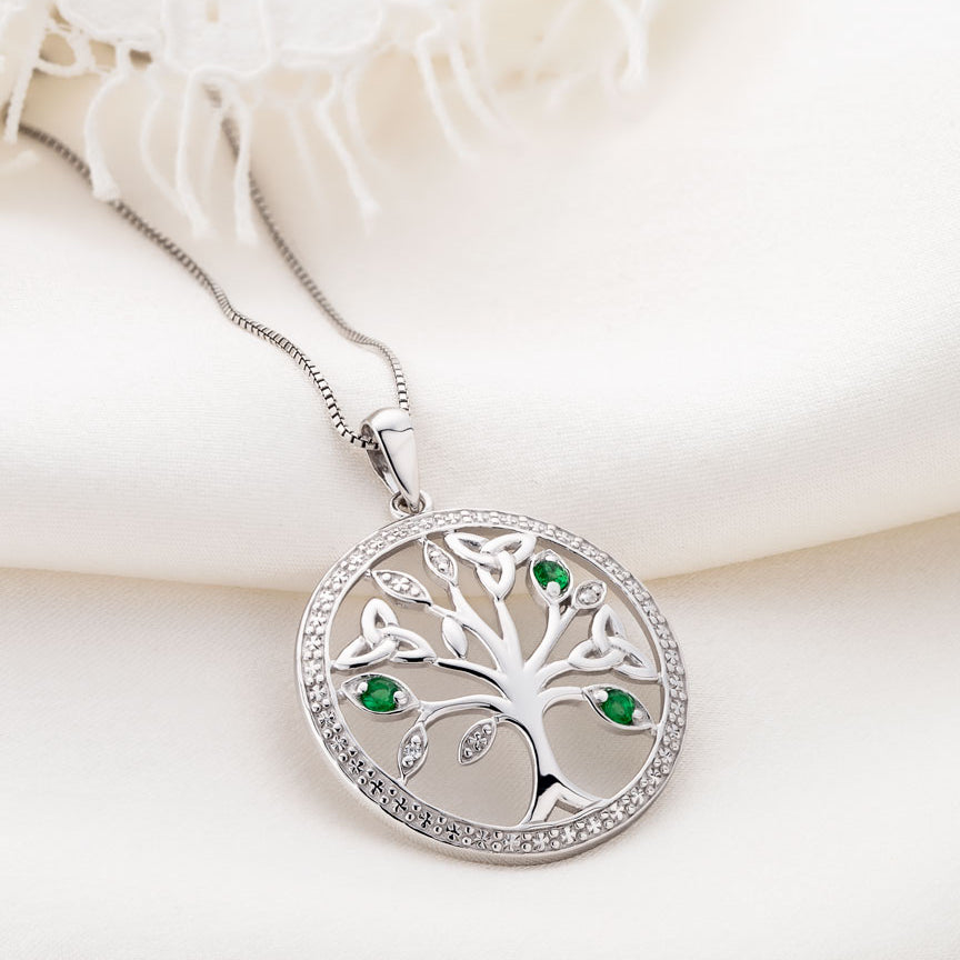 style image of silver Irish Tree of Life necklace on the light background 