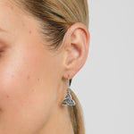 close-up image of green marble Celtic Trinity Knot earrings on a model