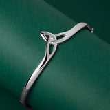 lifestyle image of sterling silver Celtic Trinity Knot bangle from Solvar
