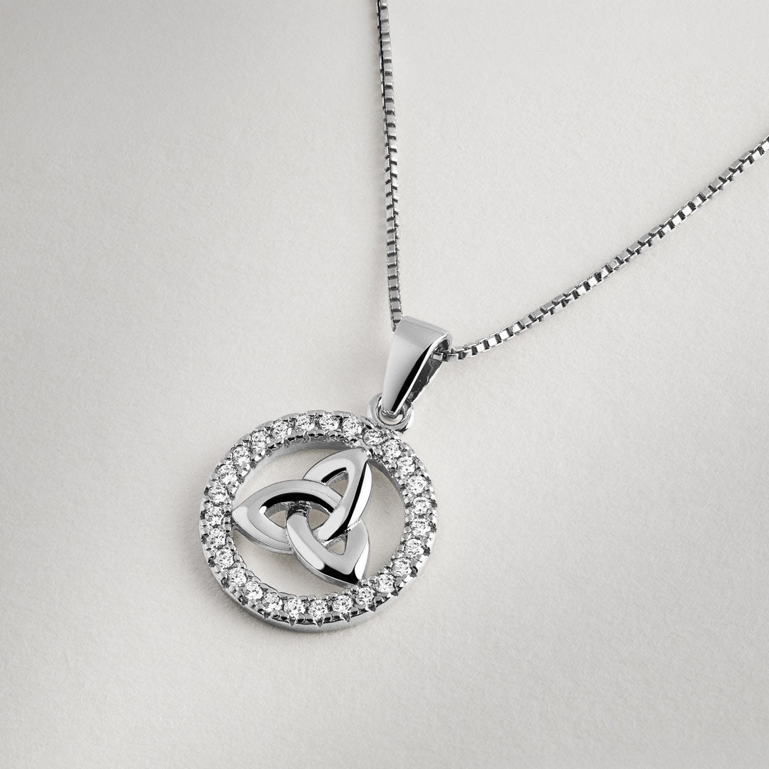 Sterling silver Celtic Trinity Knot pendant surrounded by a halo of sparkling crystals on a polished box chain necklace