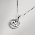 Sterling silver Celtic Trinity Knot pendant surrounded by a halo of sparkling crystals on a polished box chain necklace