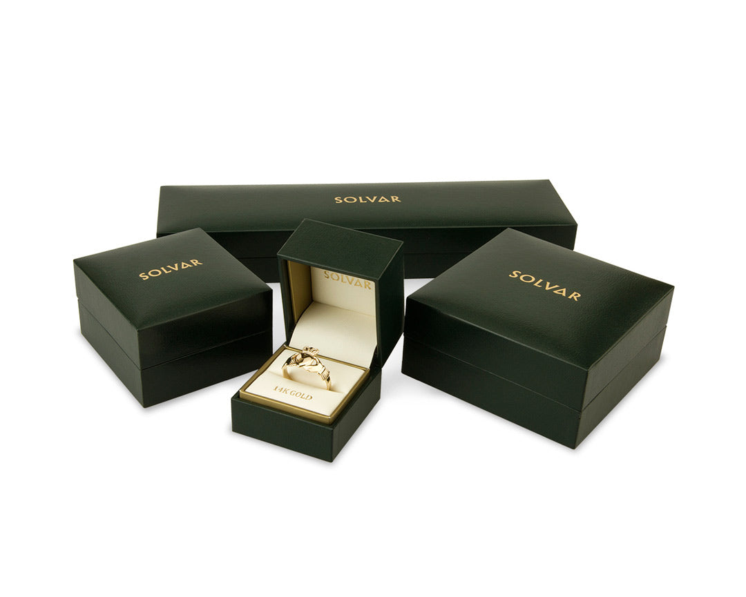 various green boxes of solvar gold jewellery collection on the white background 