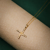 lifestyle image of gold Saint Brigids cross necklace from Solvar