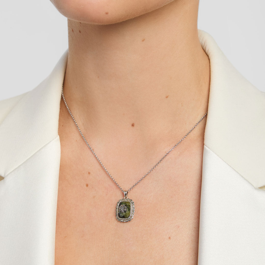model wearing celtic green marble shamrock necklace from Solvar