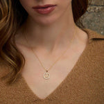 a model wearing round trinity knot necklace S46893
