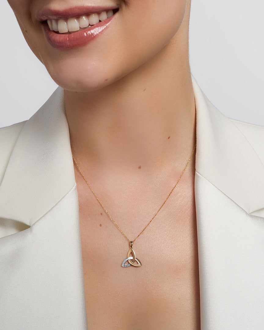 a model wearing yellow gold diamond trinity know pendant s46517