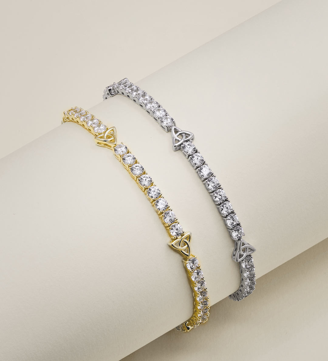 lifestyle image of Trinity Knot cz tennis bracelets available in gold and silver