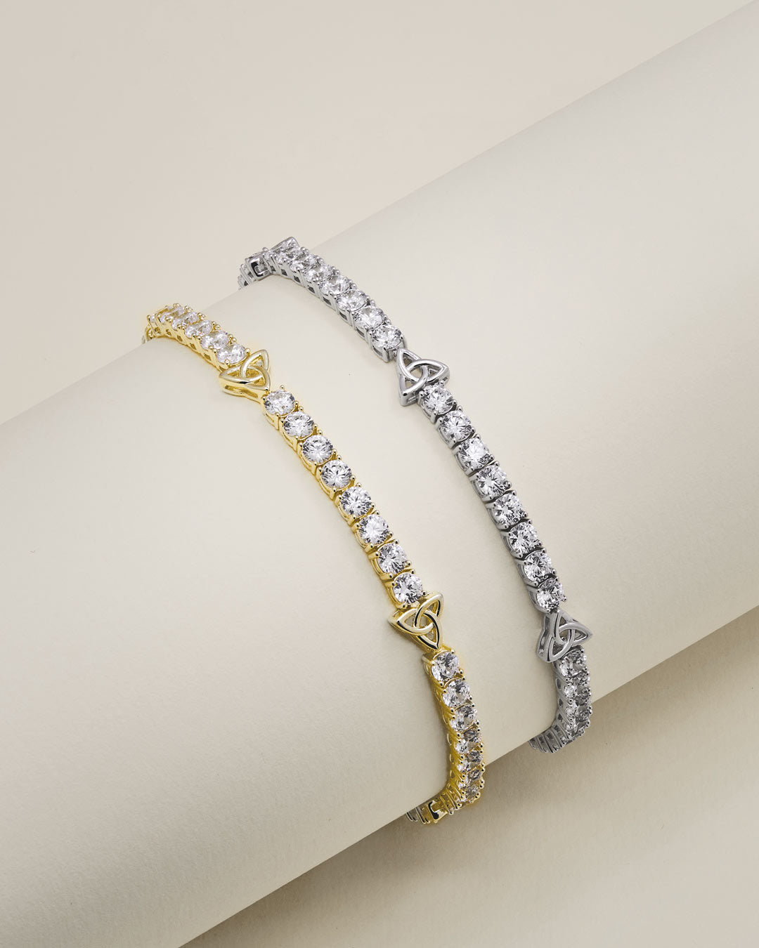 lifestyle image of Trinity Knot cz tennis bracelets available in gold and silver