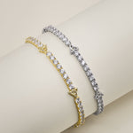 lifestyle image of Trinity Knot cz tennis bracelets available in gold and silver