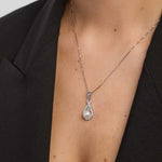 female model wearing trinity knot necklace with a pearl from Solvar 