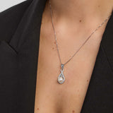 female model wearing trinity knot necklace with a pearl from Solvar 