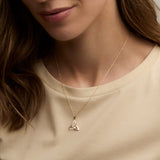 Two tone gold Trinity Knot pendant on a model