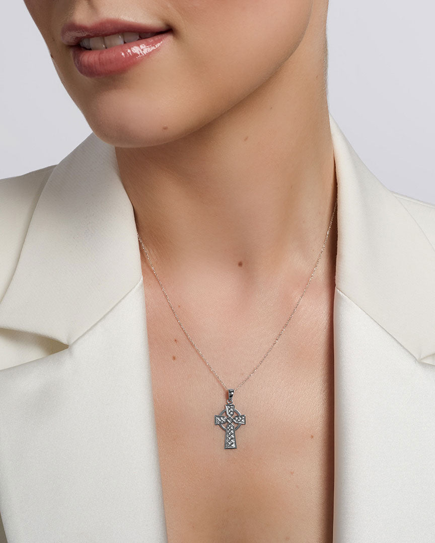 solvar white gold celtic cross necklace on a model