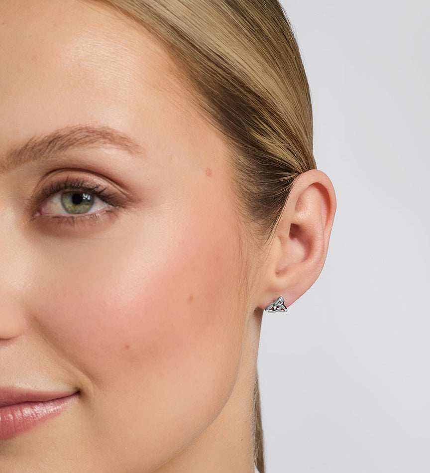 White Gold Flush Set Diamond Trinity Knot Earrings S34195 from Solvar Irish Jewellery on a model