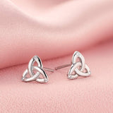 lifestyle image of white gold trinity knot stud earrings s34195